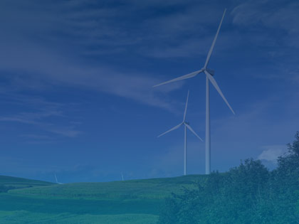 A photo of wind turbines on a hill