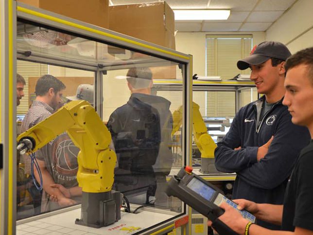 Altoona Electro-Mechanical Engineering Technology students demonstrate robotics creations as part of the annual Student Showcase.