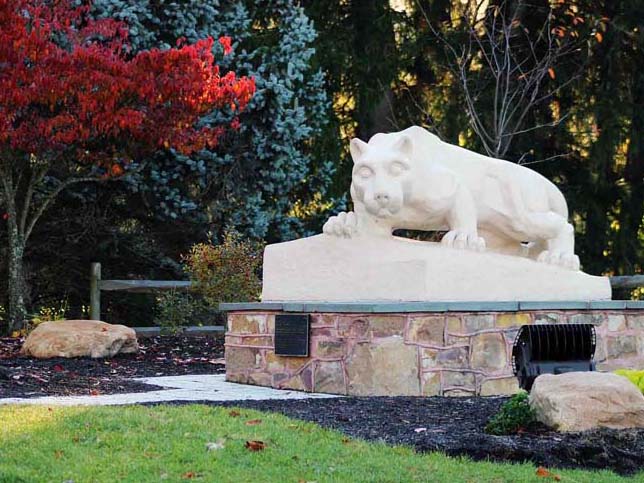 The Mont Alto Nittany Lion Shrine surrounded by fall foliage.