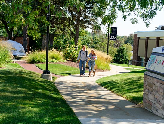 Students walking across the Penn State New Kensington campus.