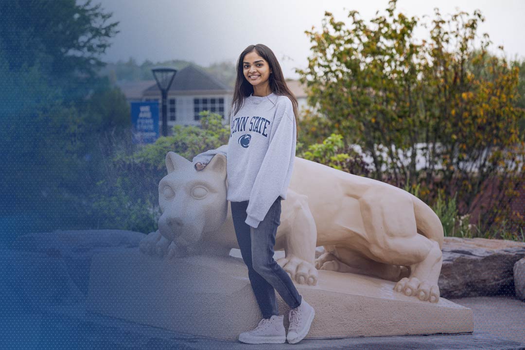 test Penn State student Dhruvi Patel standing in front of the Nittany Lion statue at Penn State Scranton
