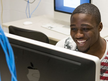 Penn State student accesses classwork remotely from a computer lab