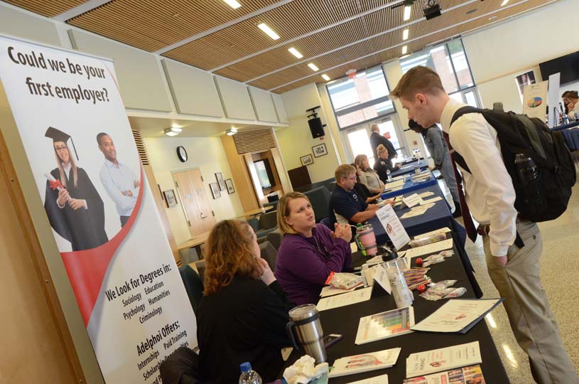 A Penn State Altoona student talks to recruiters during an on-campus career fair in the Slep Student Center.