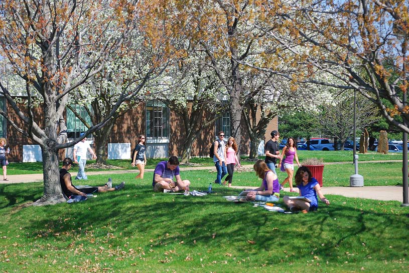 Students work on arts projects outdoors on the Penn State Fayette campus.