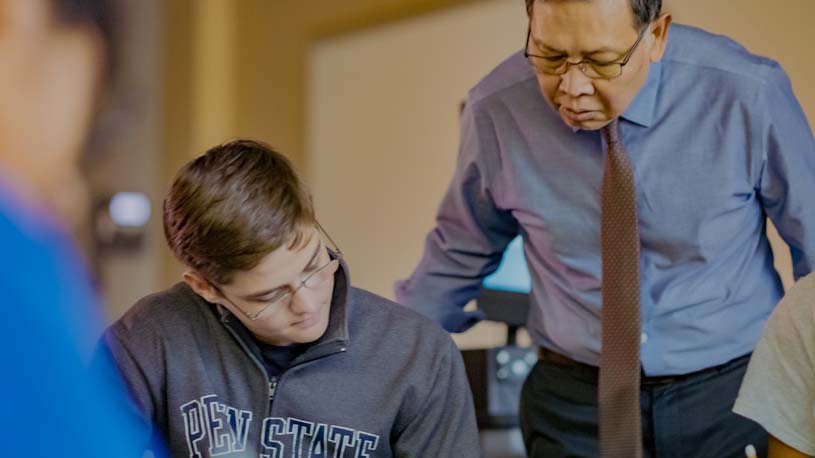 A Lehigh Valley faculty member working with student.