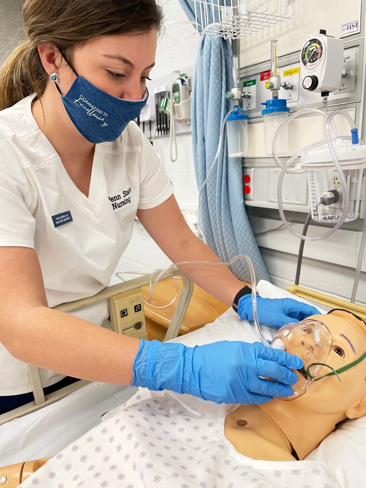 A Mont Alto student in the nursing program provides a breathing treatment on a simulated patient.