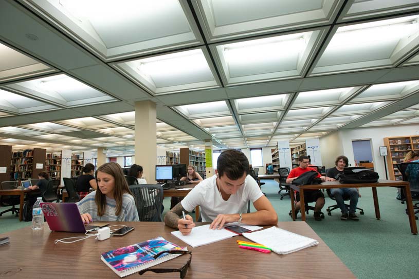 Students work in the group study area on the ground floor of Penn State Scranton’s Library.
