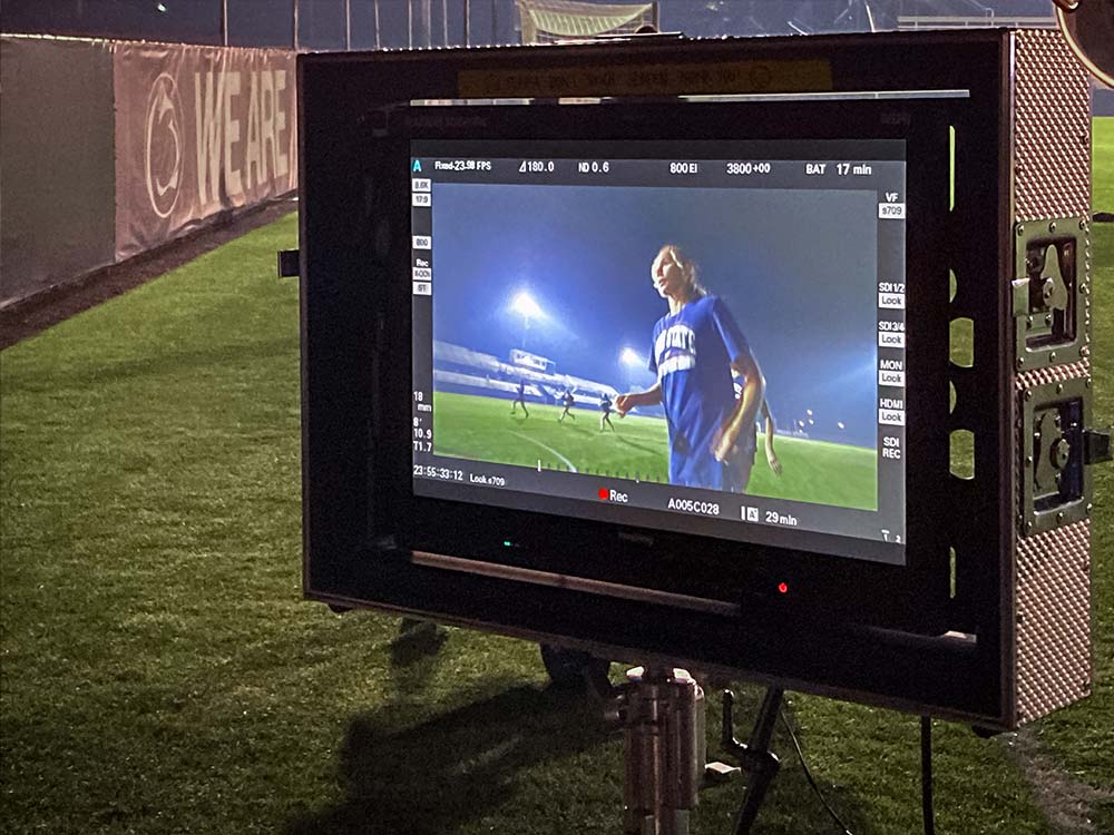 A monitor capturing soccer footage at a video production