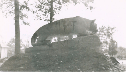 A black and white photo of the back of the Nittany Lion Shrine with “Hepcat” written in black, dripping paint.