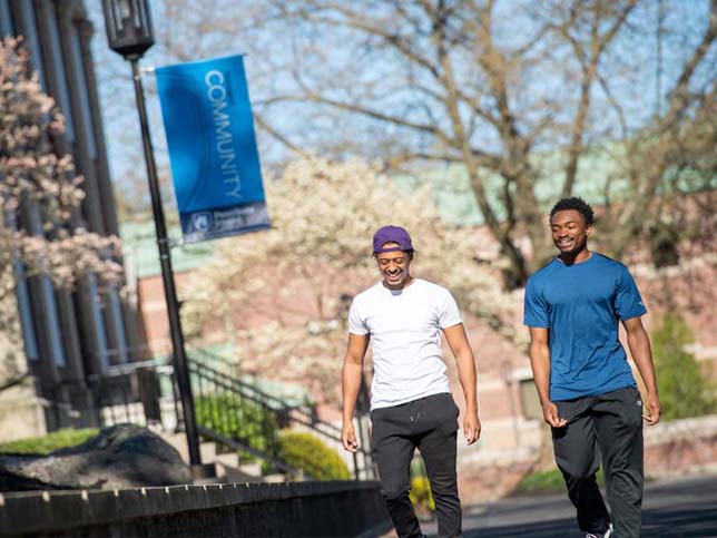 Two students walk and talk on Penn State Schuylkill’s mall walk.