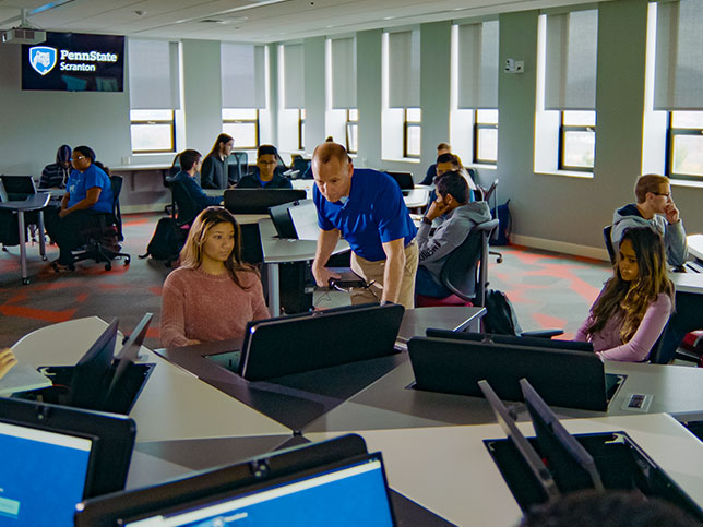 Students in a classroom working on computers