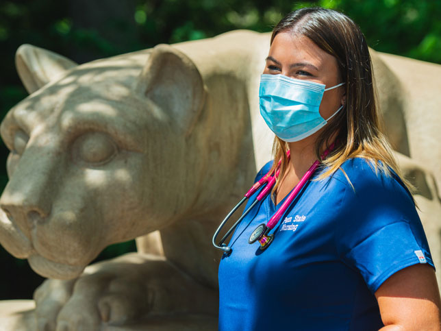 nursing student at lion shrine wearing mask