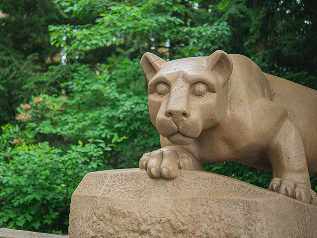 The nittany lion shrine with greenery behind
