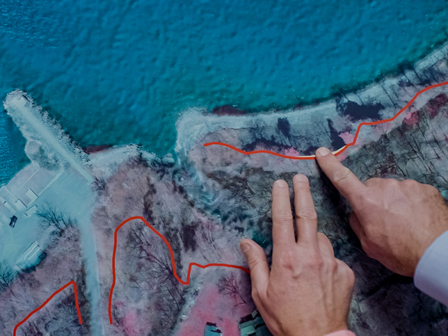 Coastline map with hands pointing to features
