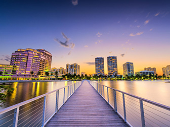 Downtown skyline of West Palm Beach, Florida, pictured at dusk from the intracoastal waterway